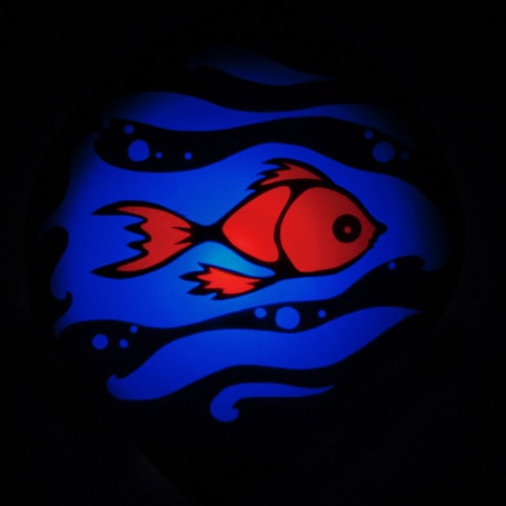 A dark shadow image with a bright orange/red fish swimming in blue water